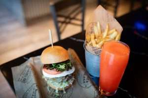 burger and fries and holiday cocktail