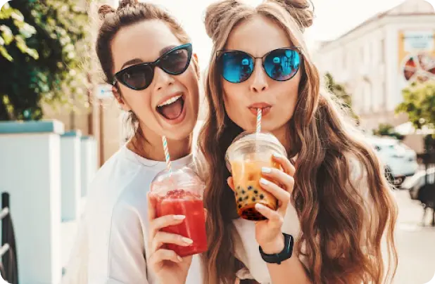Two Women Enjoying Craft Drinks