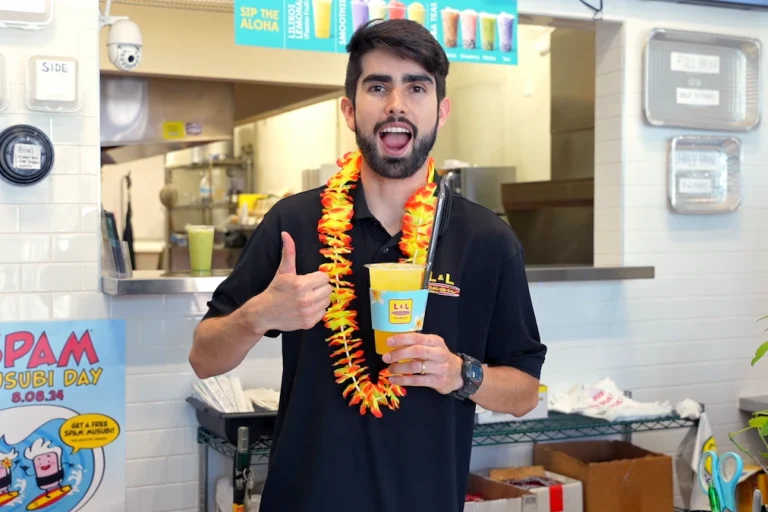 L&L Hawaiian Barbecue Ramona owner Brandon Lee holds a Botrista craft beverage and gives a thumbs-up.