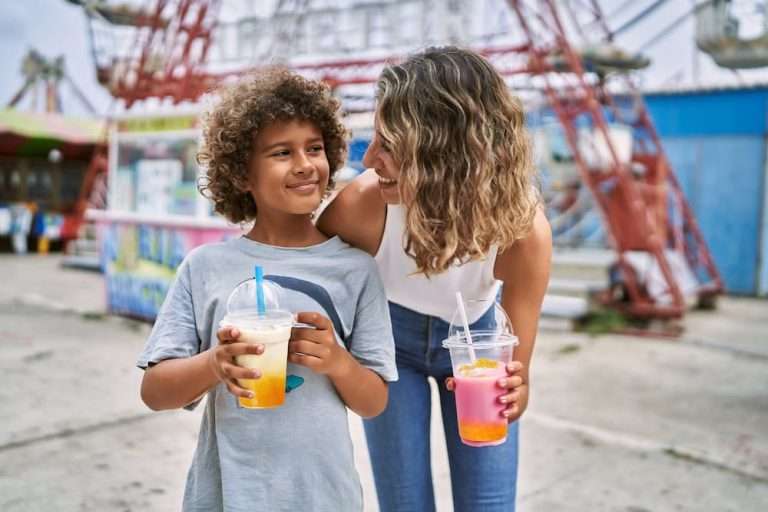 Mother and son drink boba drinks at theme park by botrista